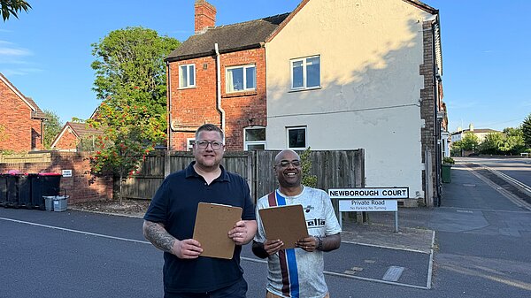 Thomas Janke and Milan Thakur with clipboards